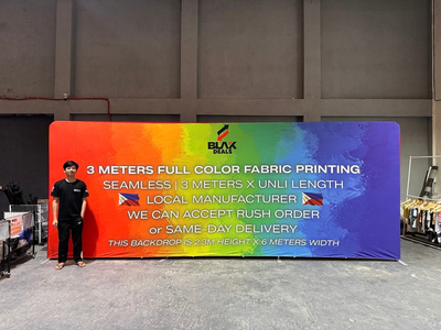 Extra-wide printed fabric wall with colorful event artwork